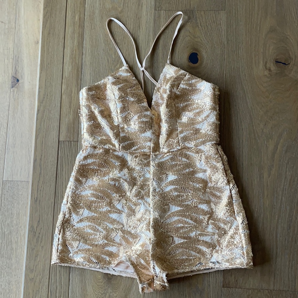 Alice McCall romper in mint condition. Cute pockets- flattering. Never worn.